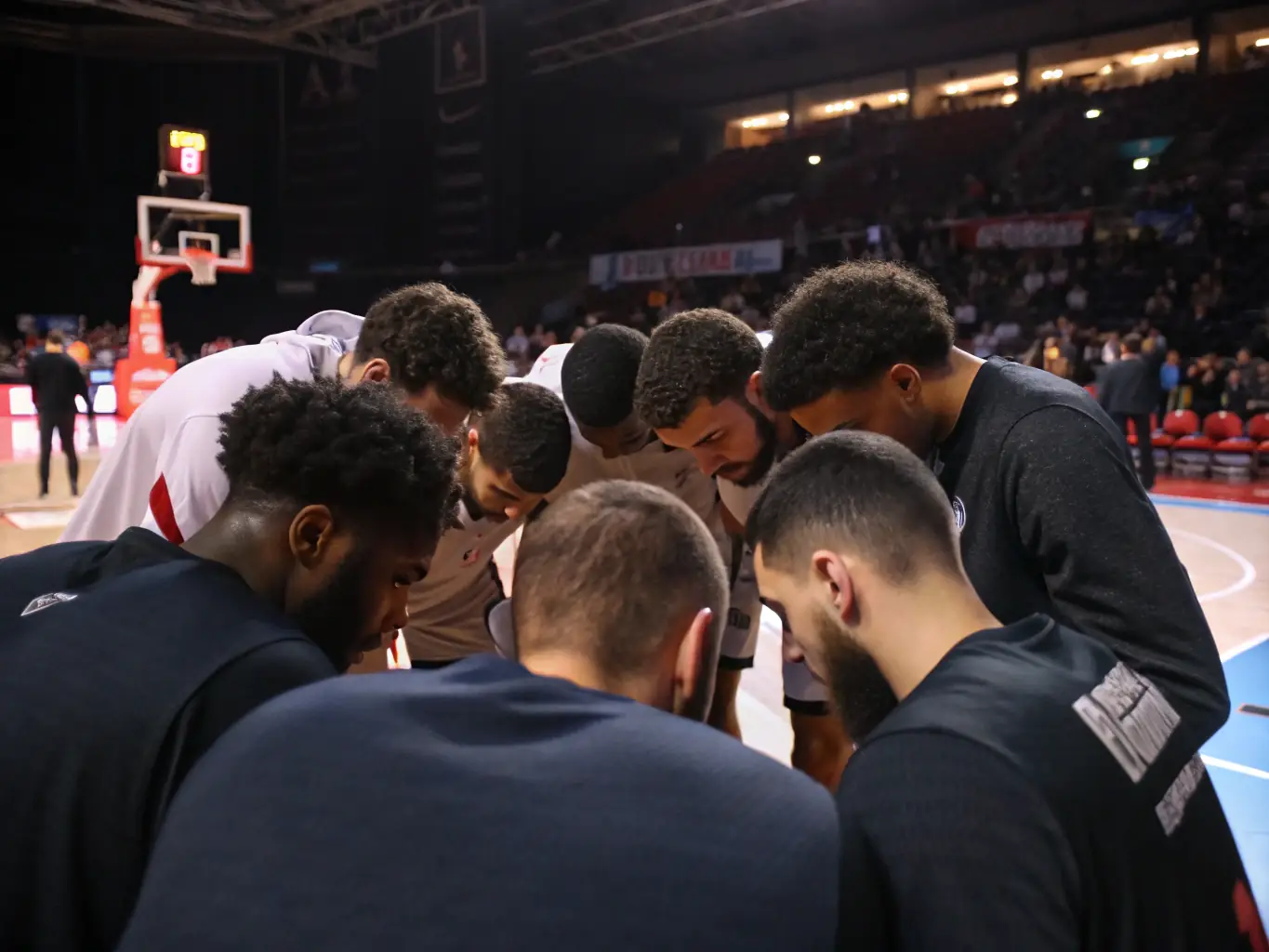 A focused image of competitive team members in a huddle, strategizing with their coach before a tournament game, highlighting the intensity and teamwork involved in competitive play.